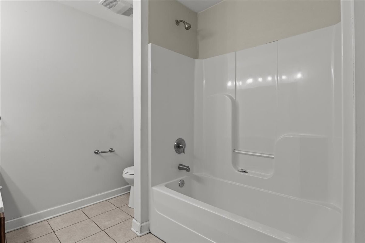 1077 Claylick Road White Bluff, TN 37187 - Photo 38 of 49 a bathroom with a bathtub a toilet and a shower