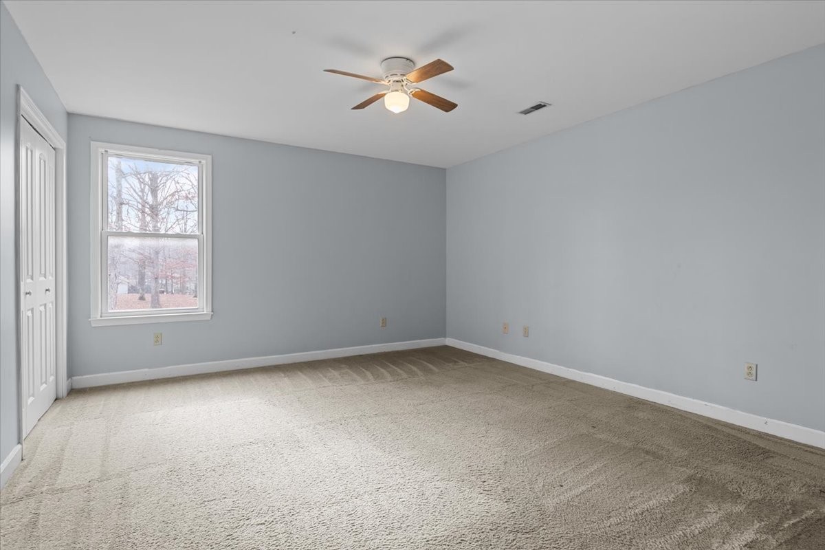 1077 Claylick Road White Bluff, TN 37187 - Photo 39 of 49 an empty room with a window and a ceiling fan