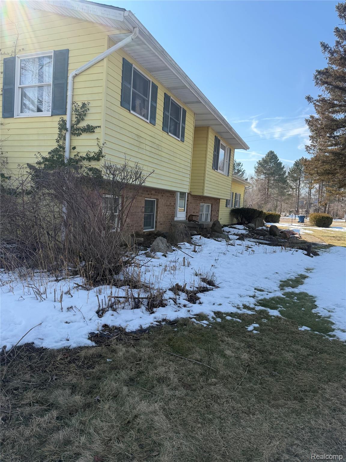 5749 Leix Road Mayville, MI 48744 - Photo 11 of 44 View of snowy exterior featuring brick siding