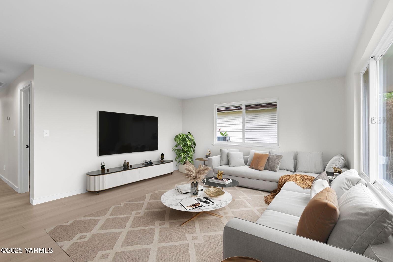 602 Meadowbrook Road Yakima, WA 98903 - Photo 2 of 42 a living room with furniture and a flat screen tv