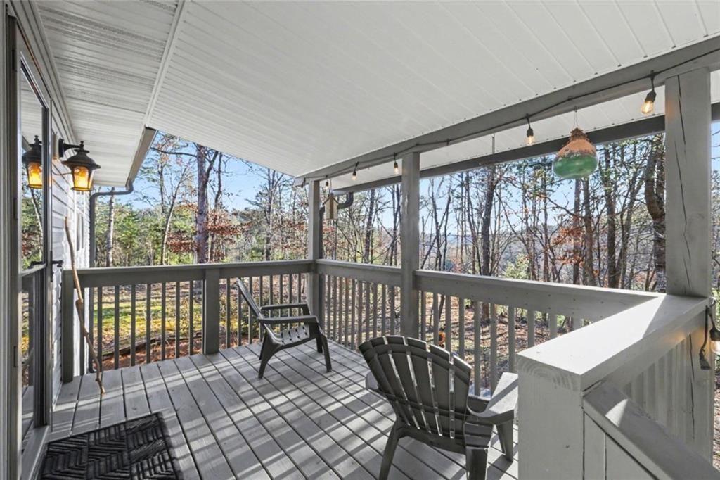 387 Ruby Lane Mineral Bluff, GA 30559 - Photo 1 of 29 a view of a balcony with furniture
