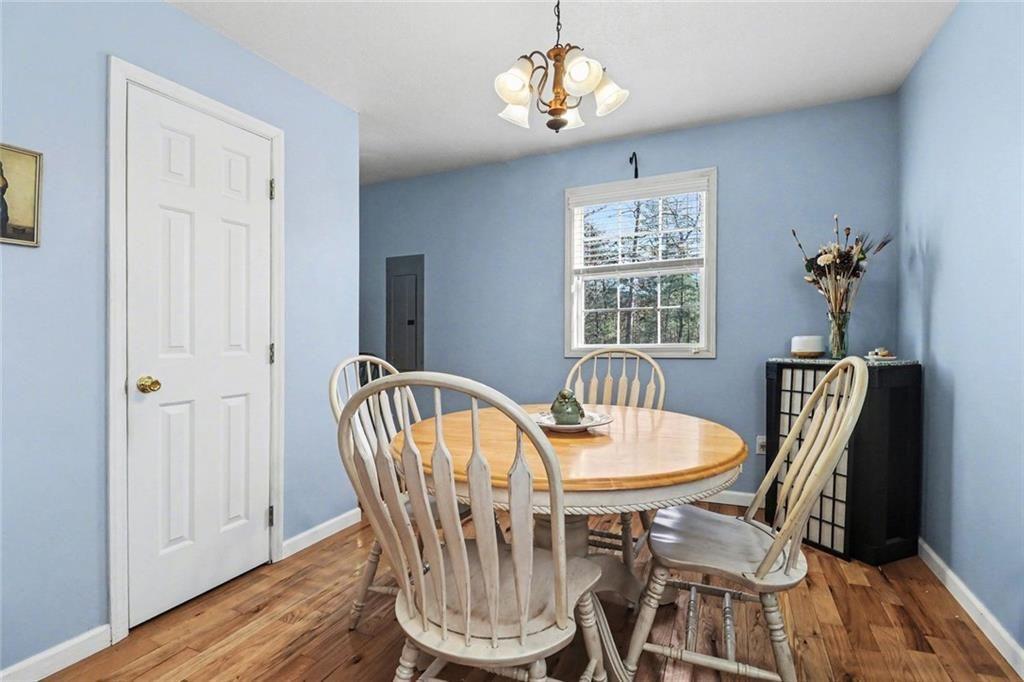 387 Ruby Lane Mineral Bluff, GA 30559 - Photo 12 of 29 a view of a dining room with furniture window and wooden floor