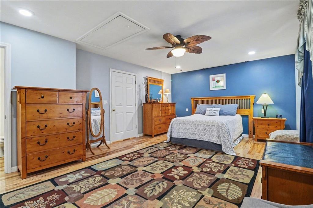387 Ruby Lane Mineral Bluff, GA 30559 - Photo 13 of 29 a bedroom with a bed and wooden floor