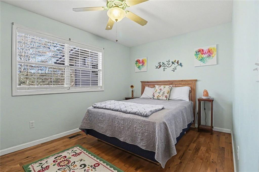 387 Ruby Lane Mineral Bluff, GA 30559 - Photo 17 of 29 a bedroom with a bed and a window