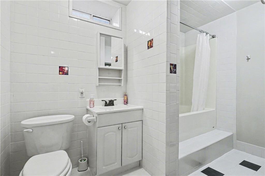387 Ruby Lane Mineral Bluff, GA 30559 - Photo 21 of 29 a bathroom with a toilet a sink and shower
