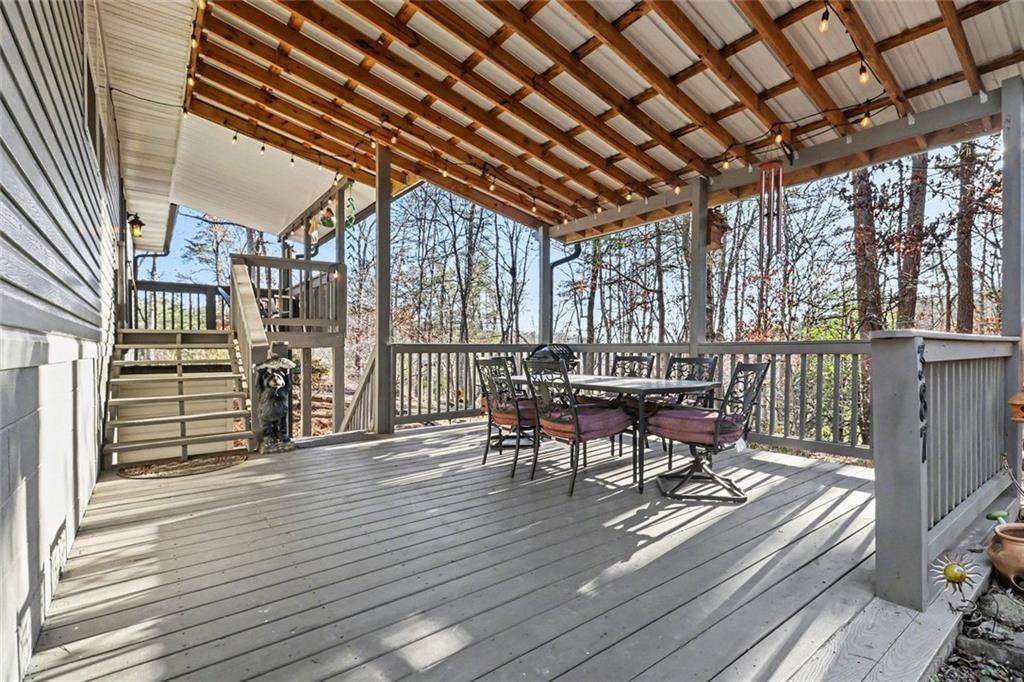 387 Ruby Lane Mineral Bluff, GA 30559 - Photo 3 of 29 a view of a patio with wooden floor