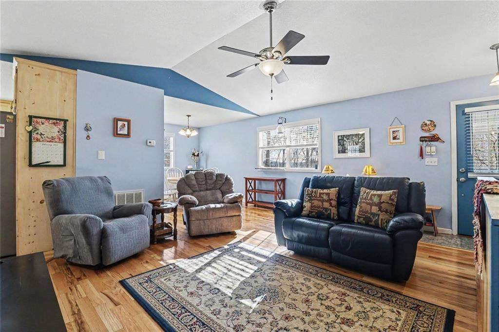 387 Ruby Lane Mineral Bluff, GA 30559 - Photo 5 of 29 a living room with furniture a rug and a window
