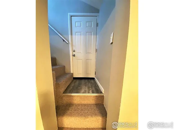 a kitchen with granite countertop a stove and a refrigerator