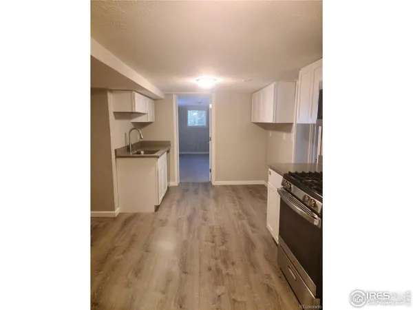 a kitchen with stainless steel appliances a refrigerator and a stove