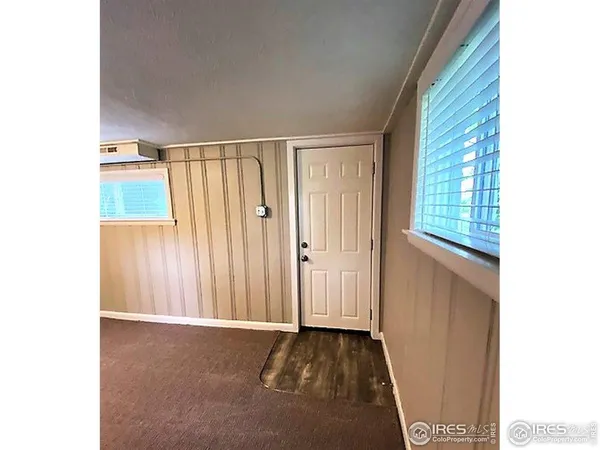 a view of an empty room with windows