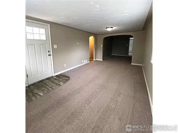 a view of a livingroom with a staircase