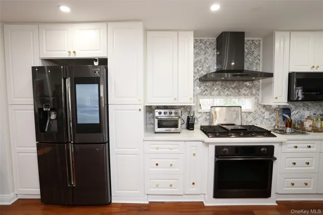 a kitchen with a stove and a refrigerator