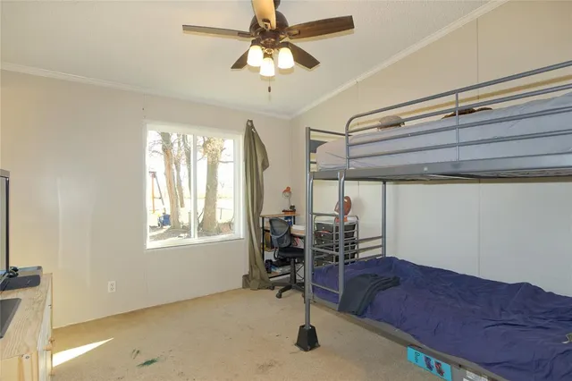 a view of a room with furniture and chandelier