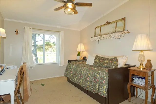 a bed room with a bed and a chair