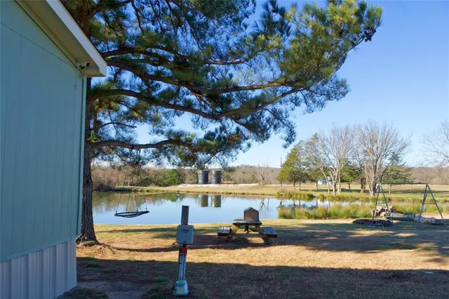 a view of a lake with a yard