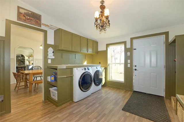 a view of a hallway with washer and dryer