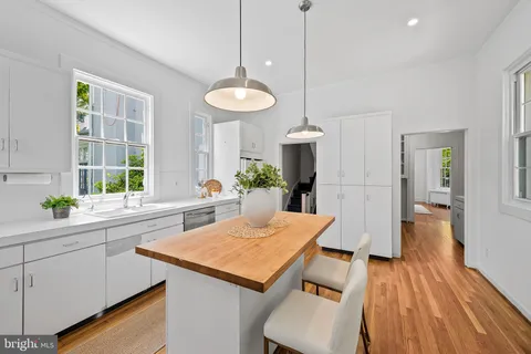a kitchen with a sink stove and window