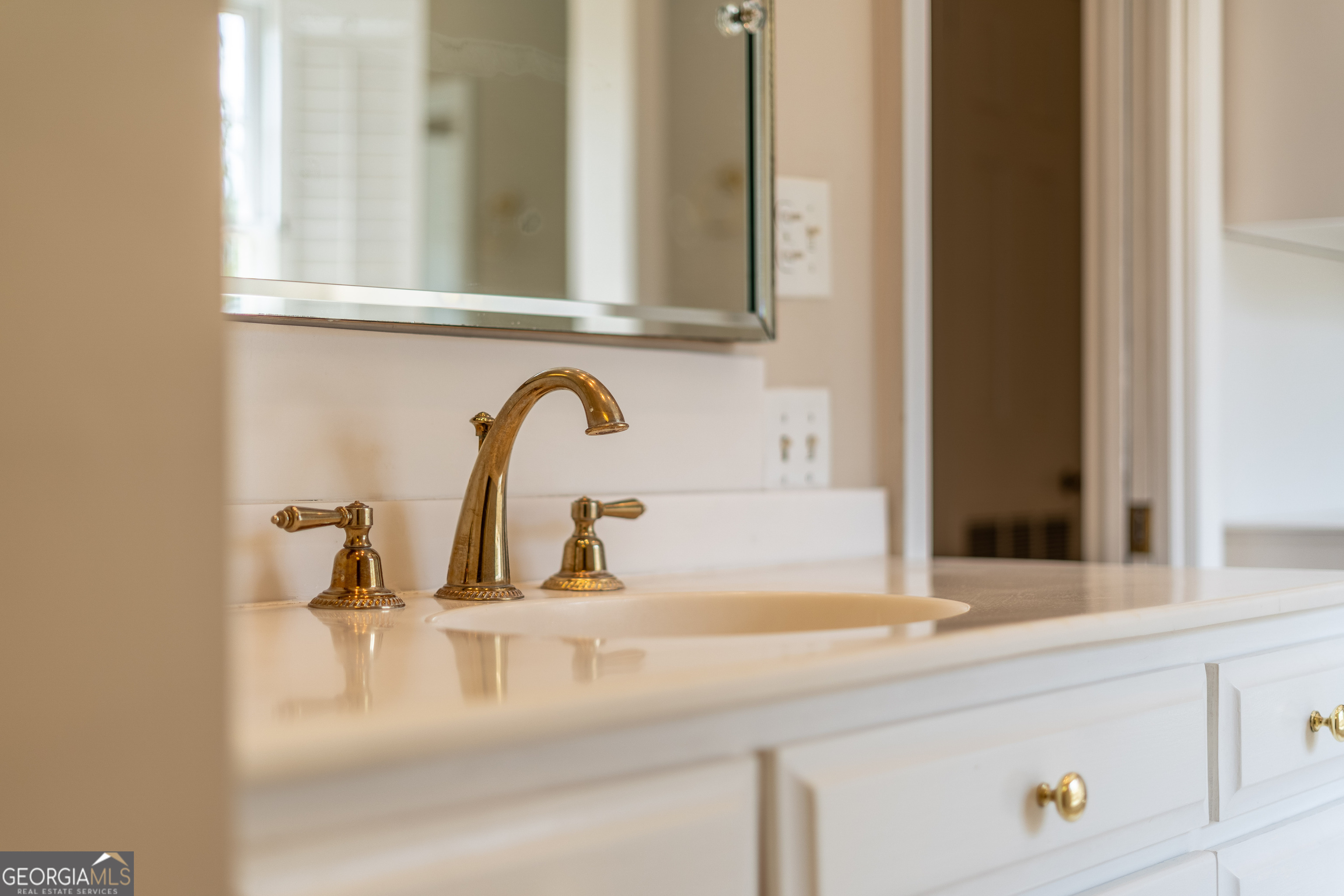 1602 Ward St Extension West Douglas, GA 31533 - Photo 63 of 70 a bathroom with a sink and a mirror