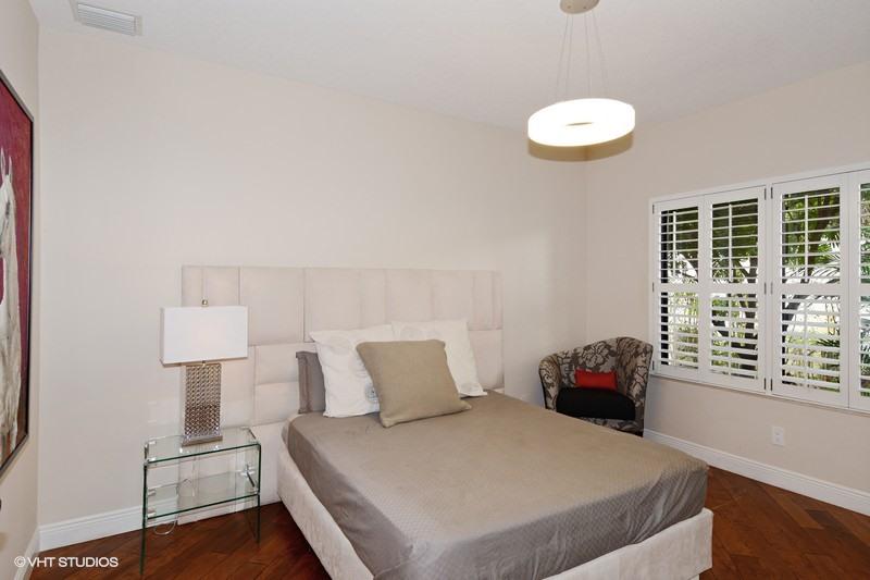 7257 Mandarin Drive Boca Raton, FL 33433 - Photo 12 of 35 a bedroom with a bed and a window