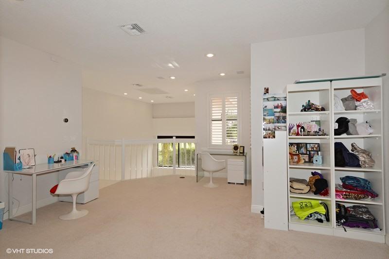 7257 Mandarin Drive Boca Raton, FL 33433 - Photo 17 of 35 a living room with furniture and a book shelf