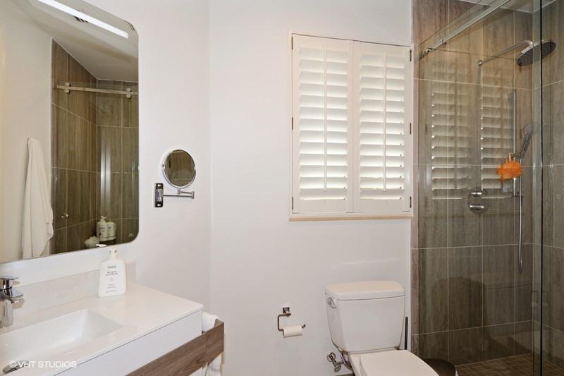 7257 Mandarin Drive Boca Raton, FL 33433 - Photo 19 of 35 a bathroom with a sink and a mirror