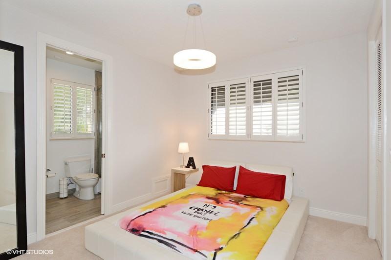 7257 Mandarin Drive Boca Raton, FL 33433 - Photo 20 of 35 a bedroom with a bed and a window