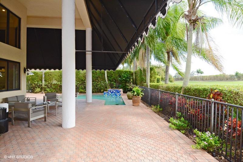 7257 Mandarin Drive Boca Raton, FL 33433 - Photo 22 of 35 a view of a patio with couches and table and chairs and potted plants