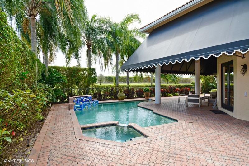 7257 Mandarin Drive Boca Raton, FL 33433 - Photo 23 of 35 a view of a swimming pool with a patio