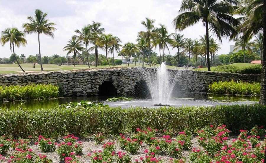 7257 Mandarin Drive Boca Raton, FL 33433 - Photo 34 of 35 a view of a garden with a fountain and a garden