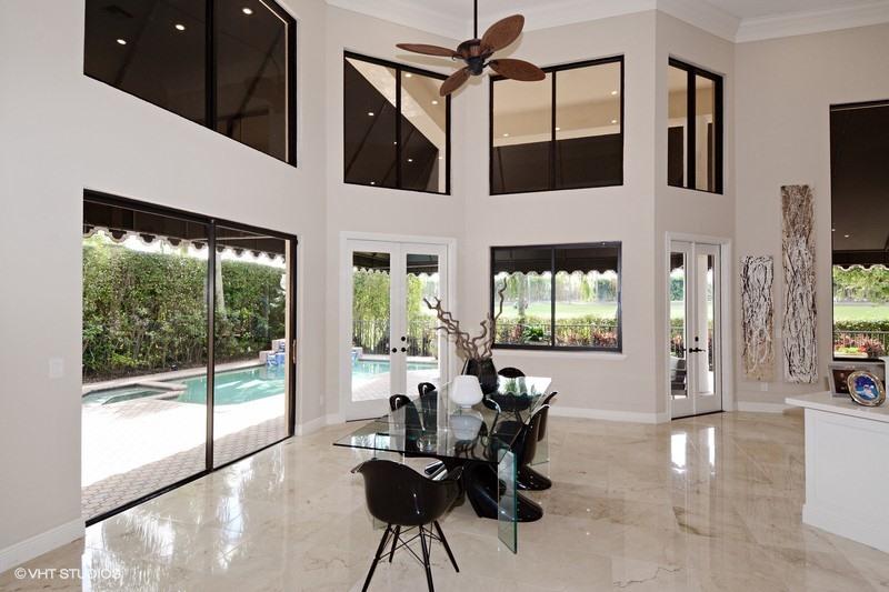 7257 Mandarin Drive Boca Raton, FL 33433 - Photo 4 of 35 a living room with furniture a floor to ceiling window and a flat screen tv