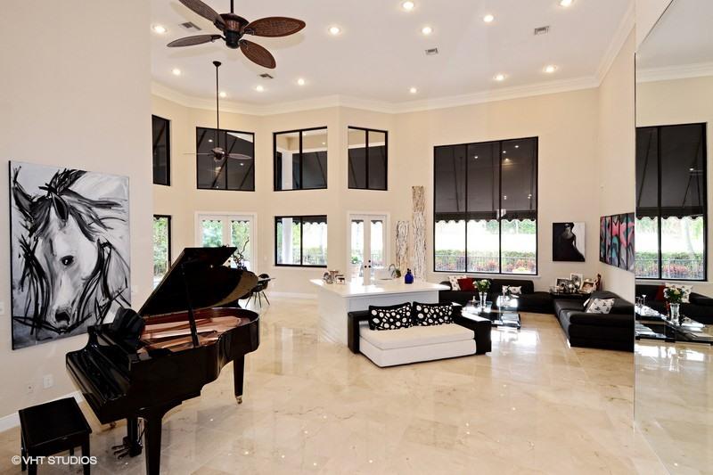 7257 Mandarin Drive Boca Raton, FL 33433 - Photo 6 of 35 a living room with furniture gym equipment and a flat screen tv