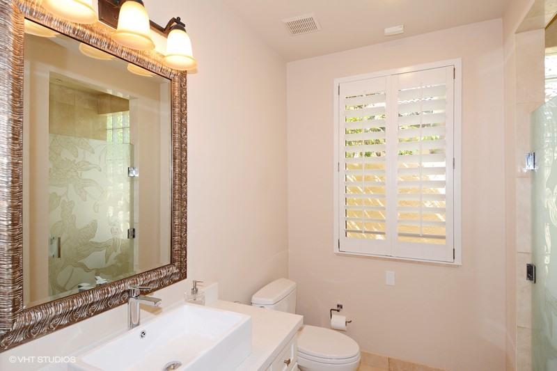7257 Mandarin Drive Boca Raton, FL 33433 - Photo 9 of 35 a bathroom with a sink a toilet and a mirror