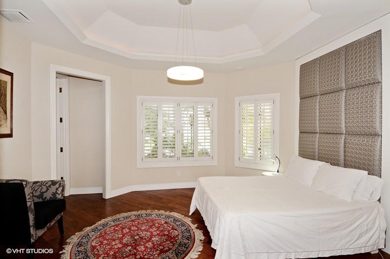 7257 Mandarin Drive Boca Raton, FL 33433 - Photo 10 of 35 a spacious bedroom with a bed and a window