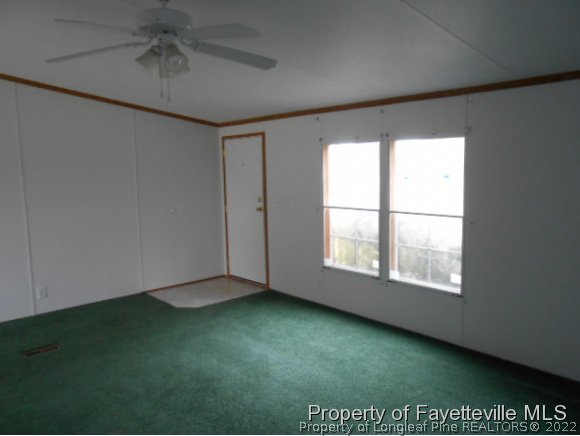 1584 Phillips Road Dunn, NC 28334 - Photo 3 of 9 an empty room with a window