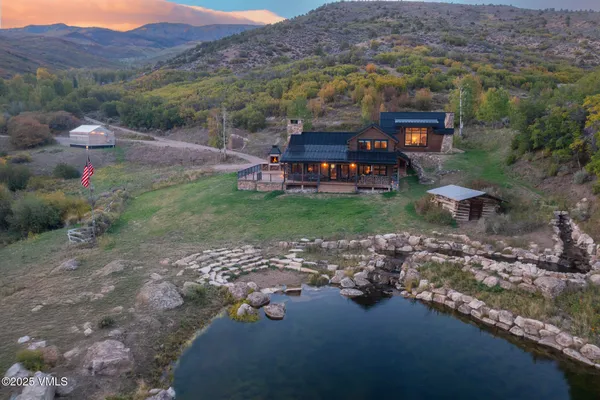 an aerial view of a backyard with mountain view