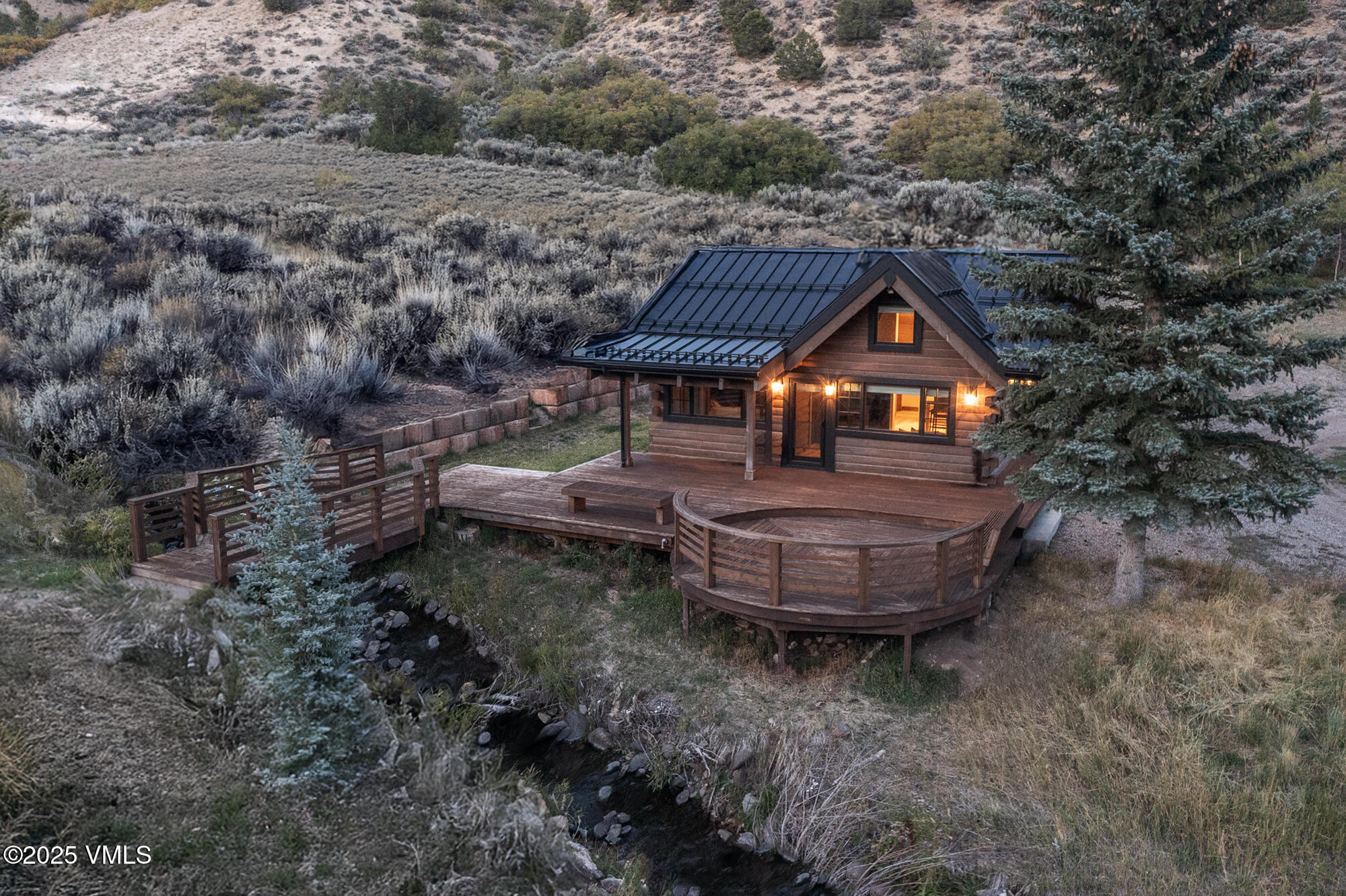 1500 West Sheep Creek Road Gypsum, CO 81637 - Photo 20 of 48 a backyard of a house with table and chairs
