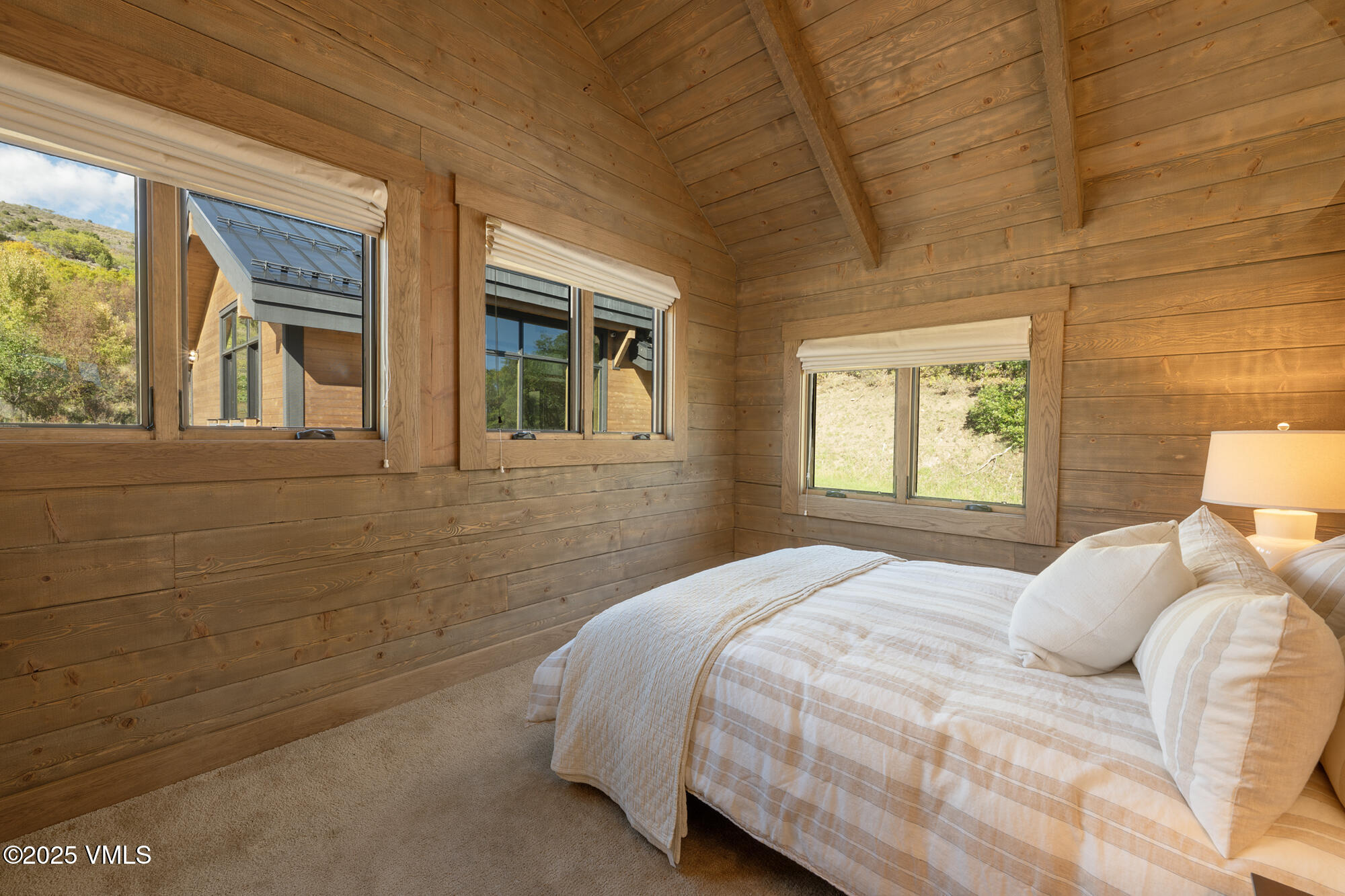 1500 West Sheep Creek Road Gypsum, CO 81637 - Photo 24 of 48 a bedroom with a bed wall painting and a window