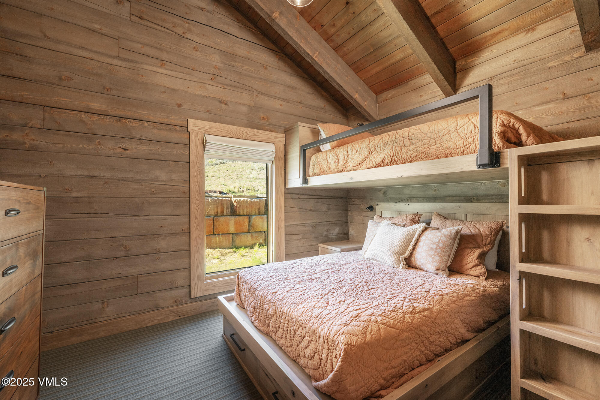 1500 West Sheep Creek Road Gypsum, CO 81637 - Photo 32 of 48 a large bed sitting in a bedroom next to a window