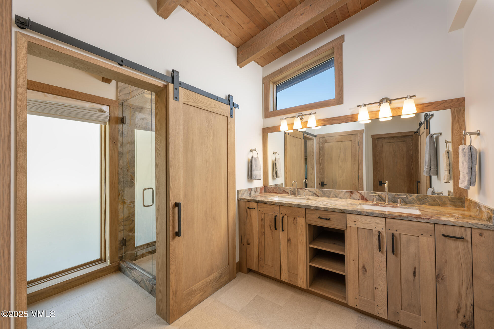 1500 West Sheep Creek Road Gypsum, CO 81637 - Photo 33 of 48 a bathroom with a double vanity sink and mirror