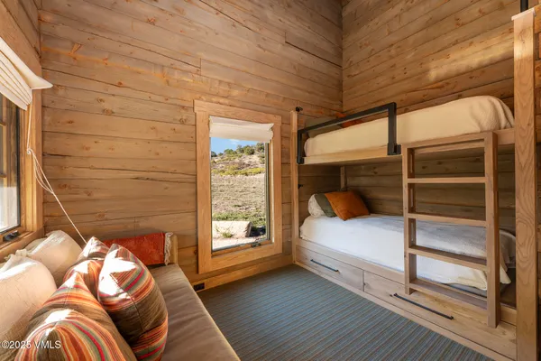 a kitchen with a stove a sink and cabinets