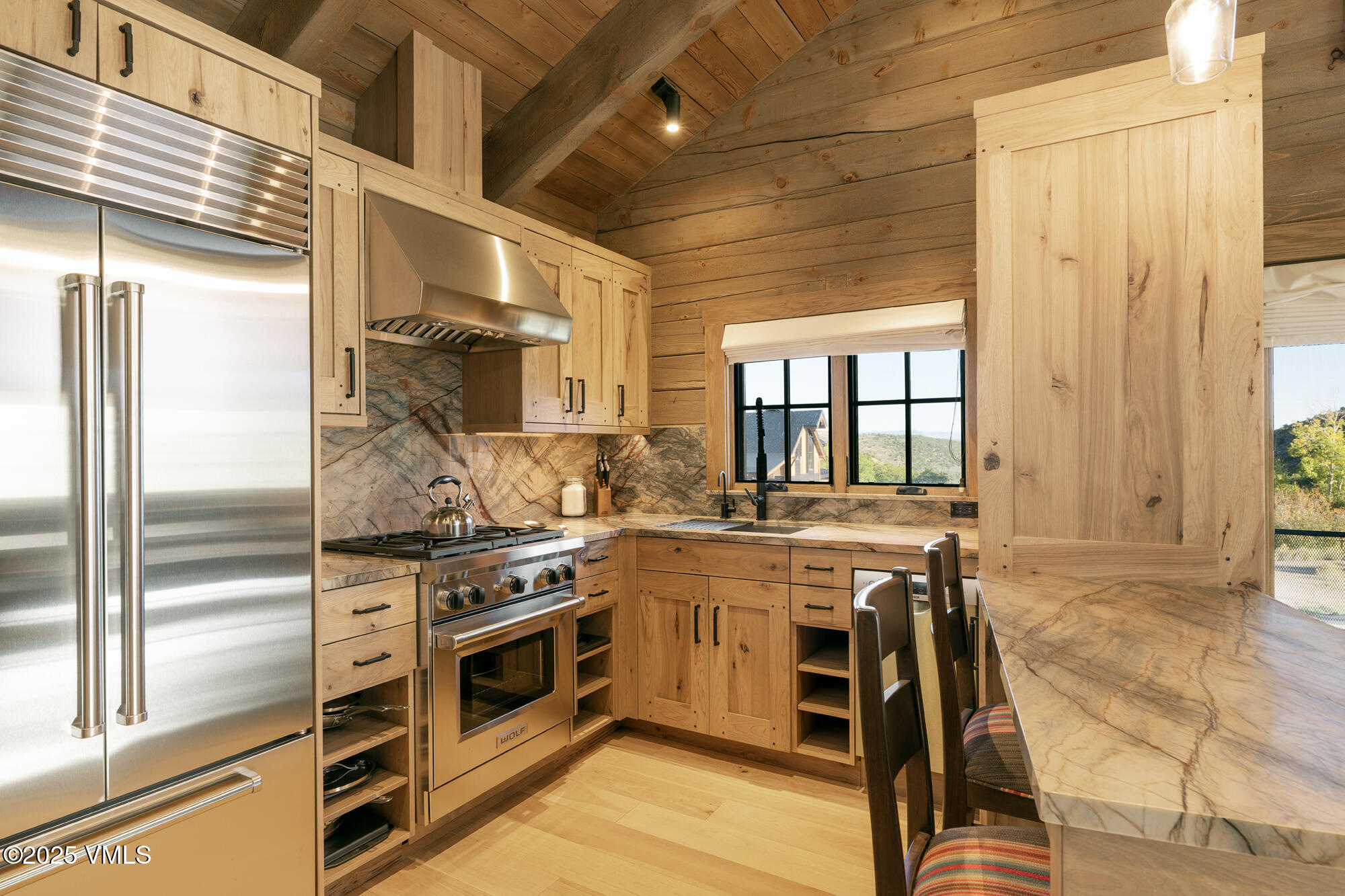 1500 West Sheep Creek Road Gypsum, CO 81637 - Photo 35 of 48 a kitchen with a stove a sink and cabinets