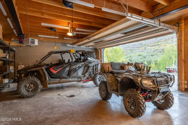 a view of parking garage with cars