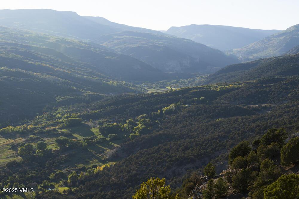1500 West Sheep Creek Road Gypsum, CO 81637 - Photo 44 of 48 a view of a field with mountains in the background