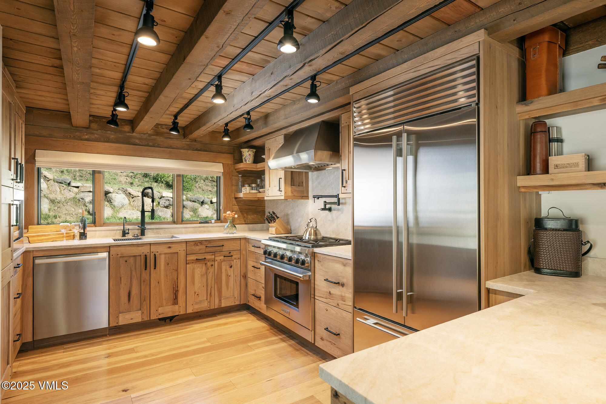 1500 West Sheep Creek Road Gypsum, CO 81637 - Photo 6 of 48 a kitchen with stainless steel appliances granite countertop a refrigerator a stove and a sink