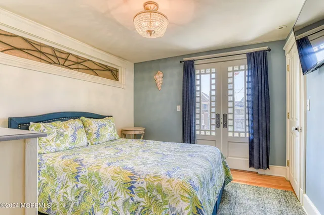 a bedroom with a large bed and a large window