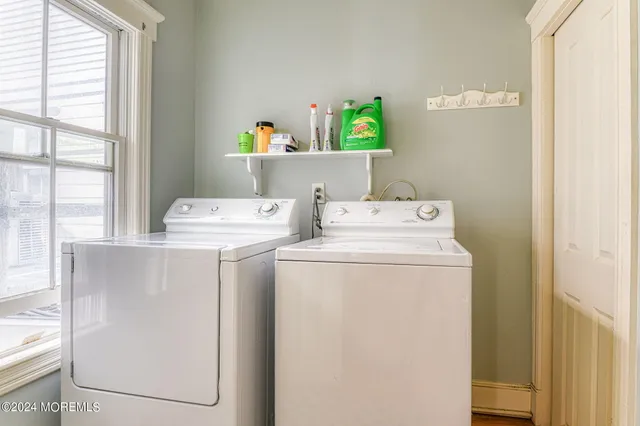 a bedroom with a bed and a large window with outer view