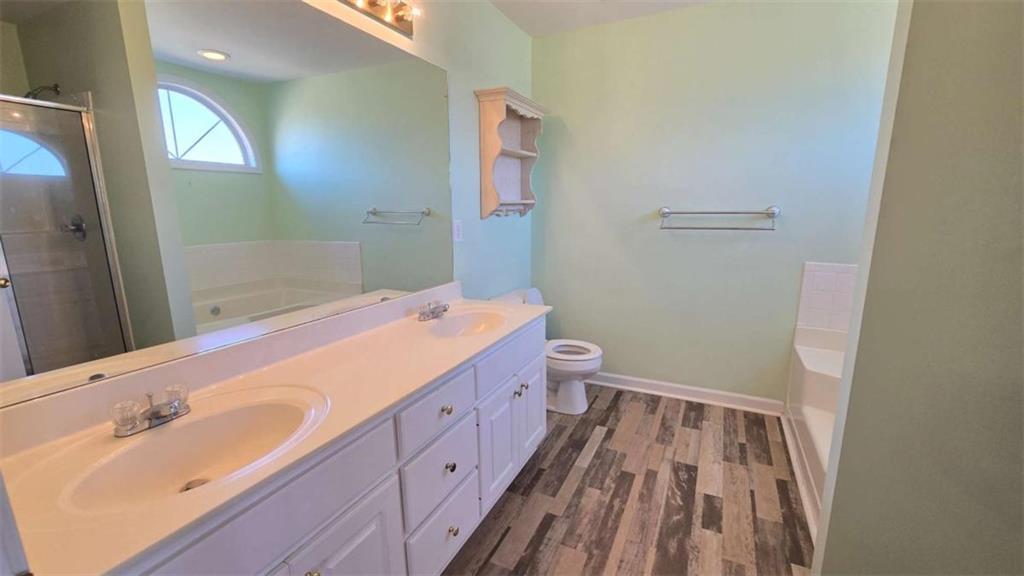 352 Olde Wick Trail Hoschton, GA 30548 - Photo 18 of 34 a bathroom with a sink and a mirror