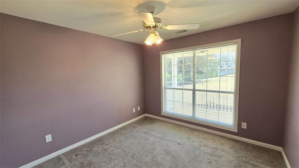 352 Olde Wick Trail Hoschton, GA 30548 - Photo 21 of 34 a view of an empty room with a window
