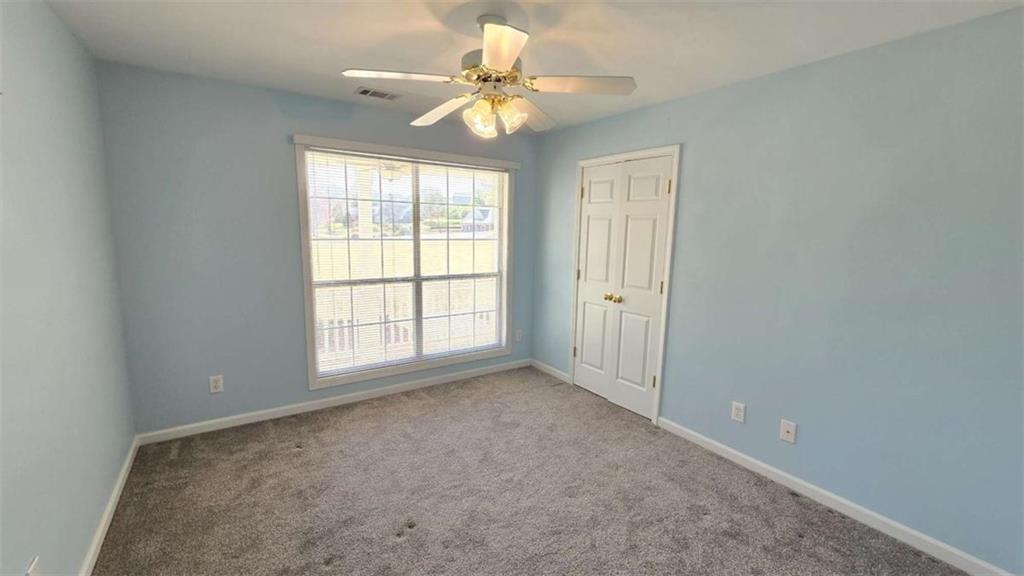 352 Olde Wick Trail Hoschton, GA 30548 - Photo 23 of 34 a view of an empty room with a window