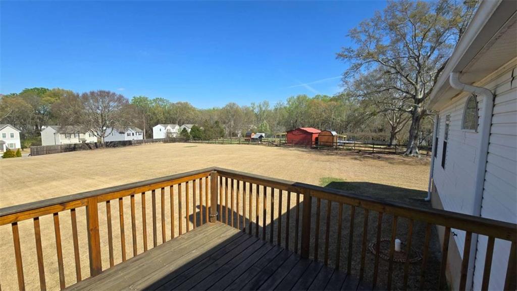 352 Olde Wick Trail Hoschton, GA 30548 - Photo 26 of 34 a view of city and mountain from a balcony